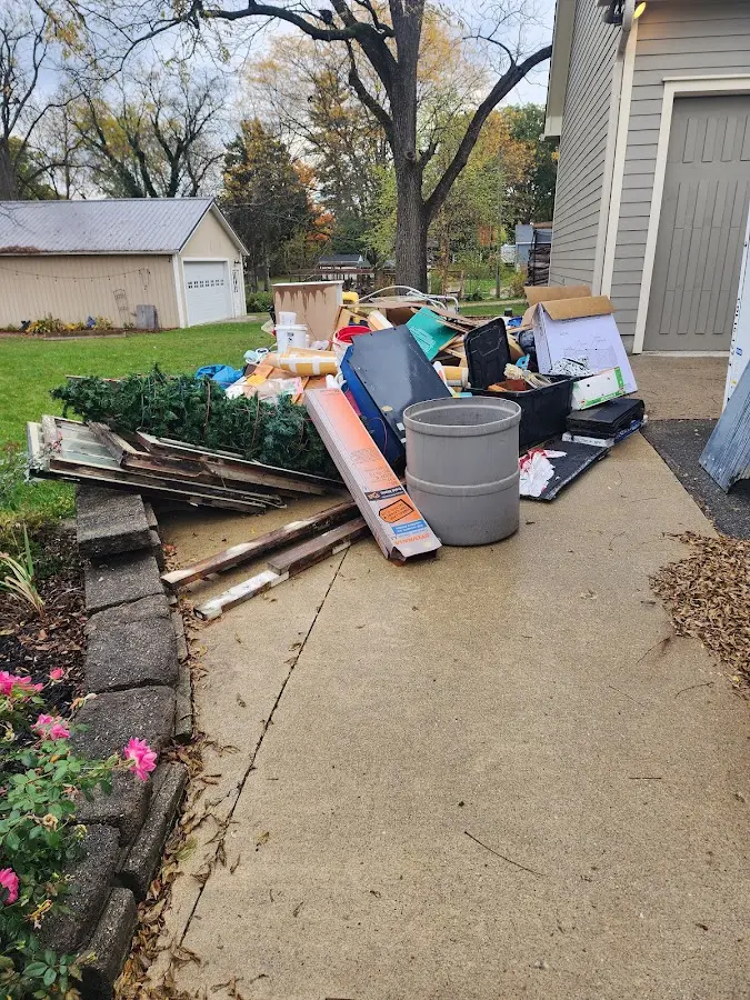 Dumpster being loaded with debris for 30 Yard Dumpster Rental in Mechanicsburg